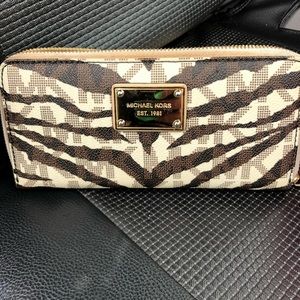 Michael kors beige/brown animal print wallet.